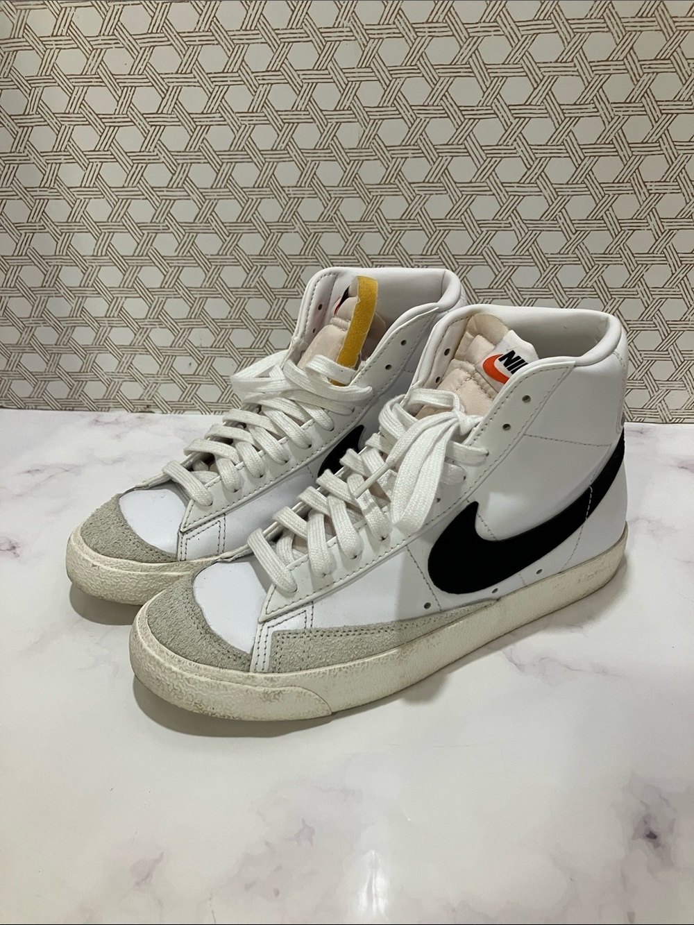 Nike White High-Top Sneakers with Black Swoosh and Yellow Tongue